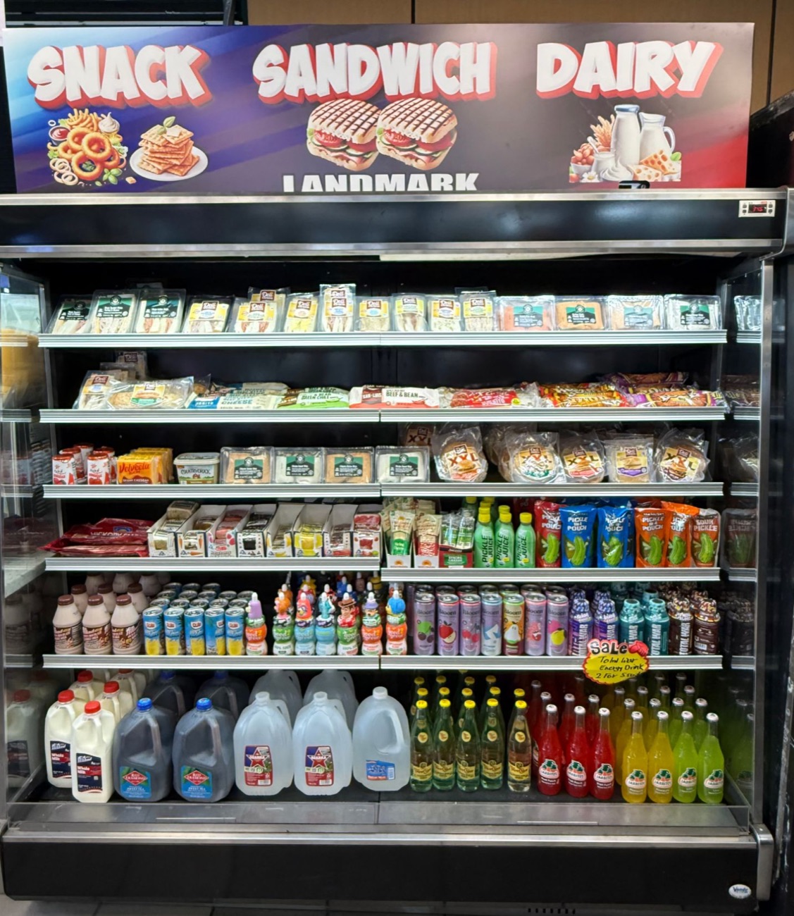 Snack, sandwich and dairy cooler with sandwiches, burritos, breakfast sandwiches, milk, water and Jarritos