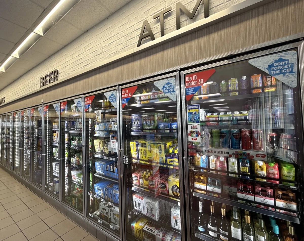 Wall of coolers with beer, seltzers and wine