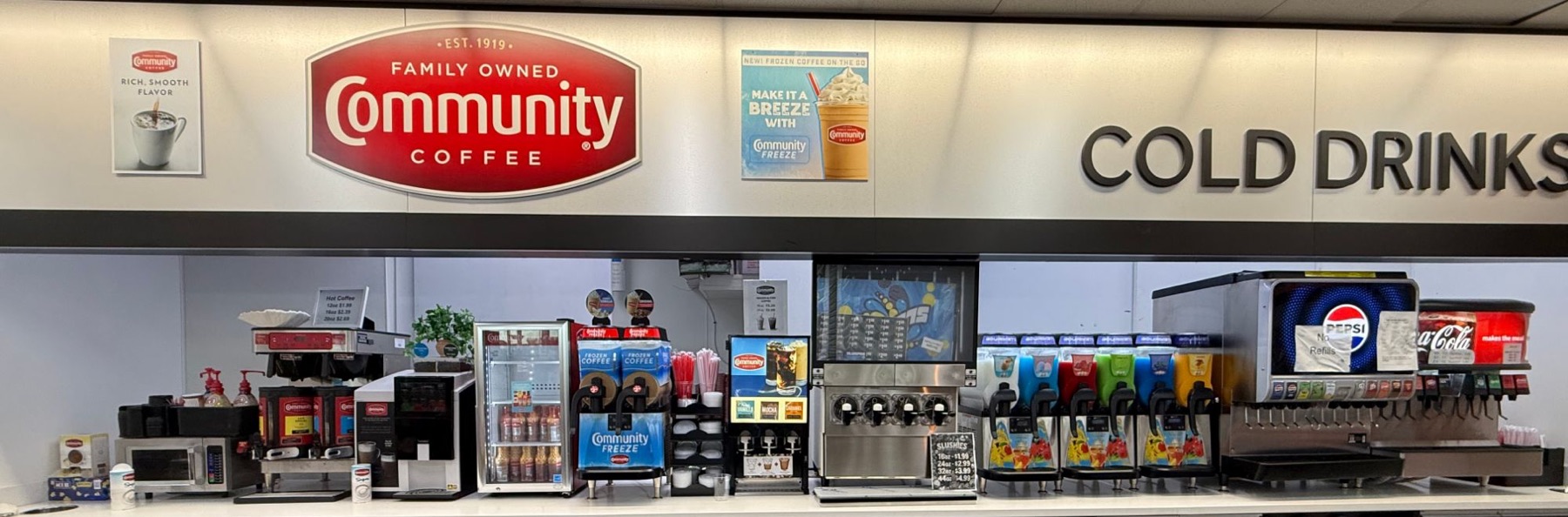 Coffee and cold drinks bar with Community Coffee, frozen coffee, slushies and Pepsi and Coca-Cola fountains