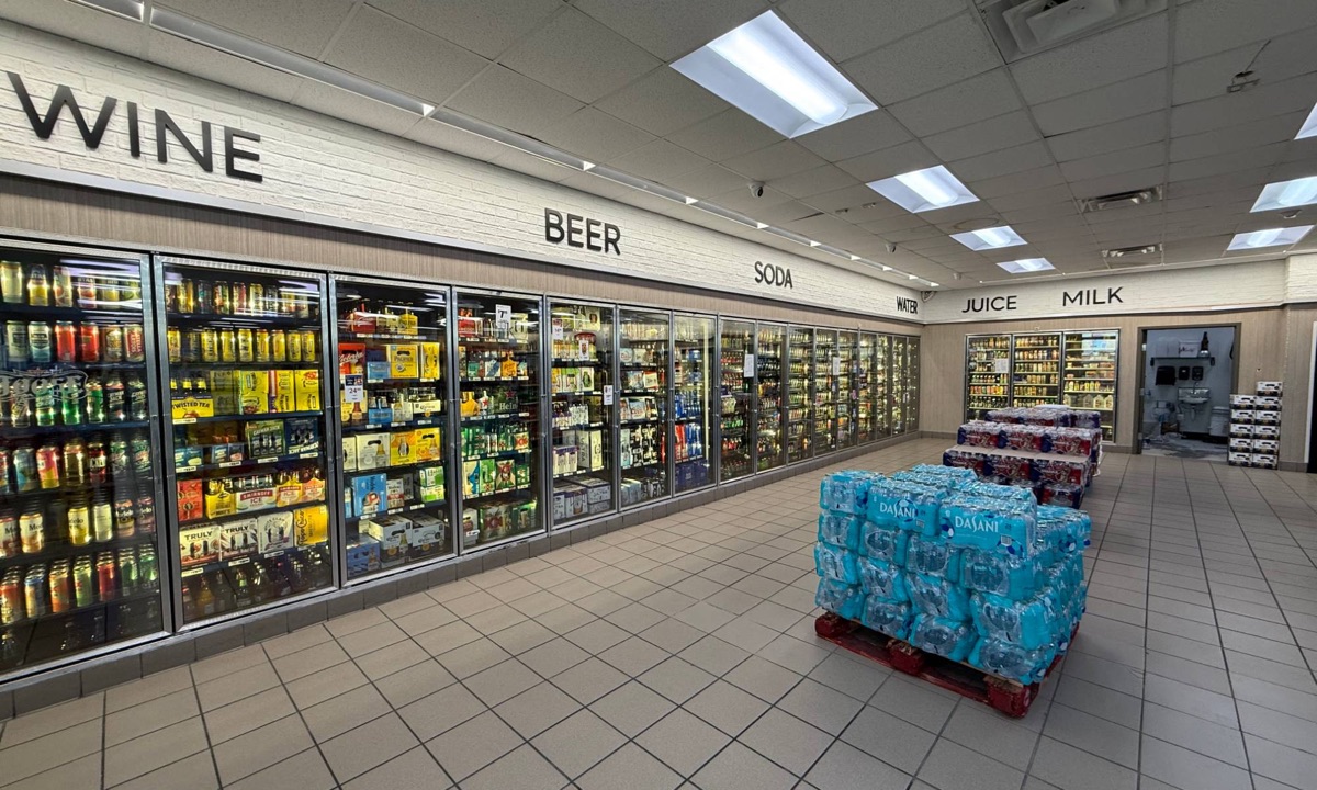 Wall of coolers with wine, beer, soda, water, juice and milk
